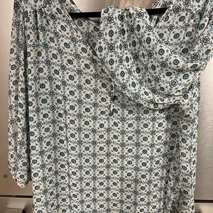 Living Doll brand, sheer top with teal buttons and wide elastic sleeves. 2x